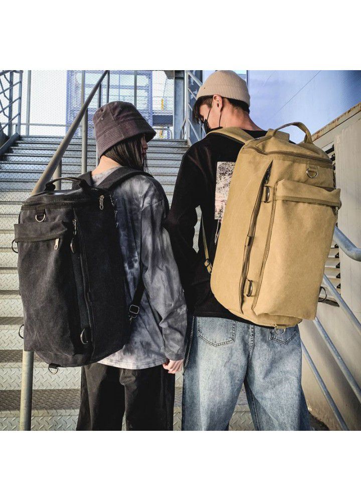 Fashion men's bag large capacity Travel Backpack men's outdoor travel sports cylinder backpack trend canvas bag 